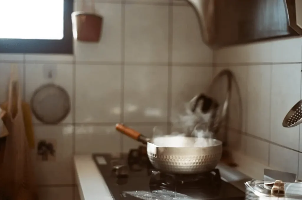remove debris on gas burners with dish soap and vinegar