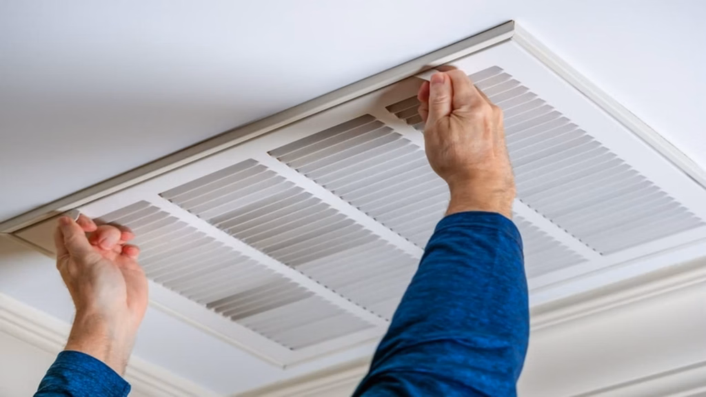 Technician Checking Ducted Heating
